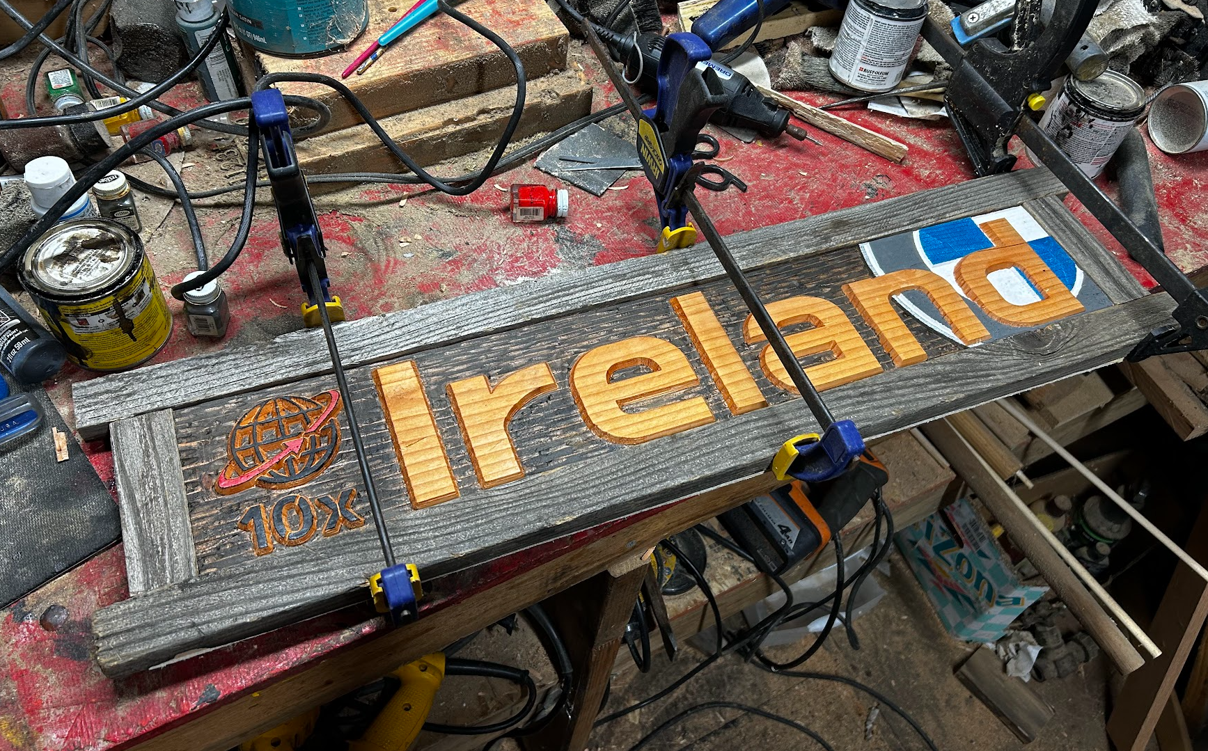 A sign being meticulously crafted